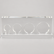 Load image into Gallery viewer, Clear acrylic four-opening BellaSkin handpiece holder, straight-on studio view