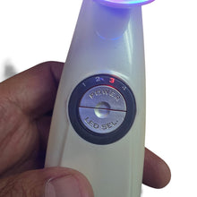 Cargar imagen en el visor de la galería, BellaSkinUSA Time Master Pro ultrasound skin device with LED light settings and power controls held in hand
